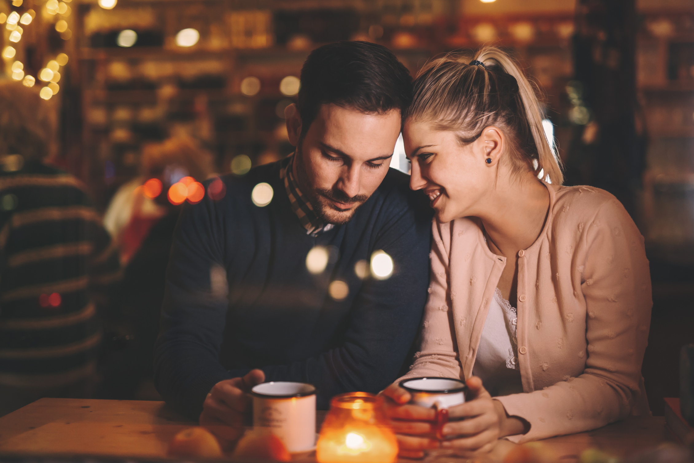 Couple dating at night in pub